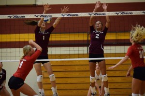 Freshmen RaeLee Hightower and Brooke Hershberger go up for a block. Photo by Masayo Satoh
