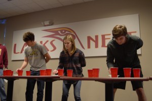 Collin Leonard, Morgan Leavy, and Hayden Pentecost playing the Minute to Win it game "Separation Anxiety". Photo by Meredith Spicher