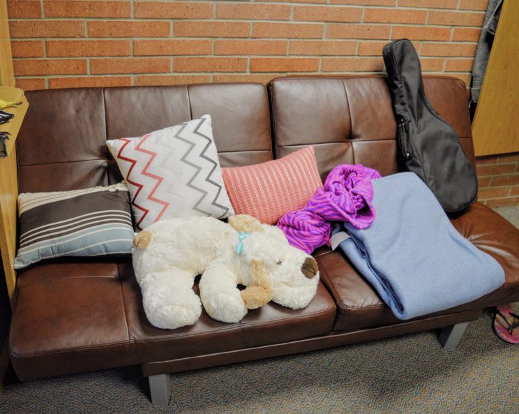 Roommates Lilian Trifena and Yedidiya Zewdu decorated their couch with some colorful pillows and blankets.